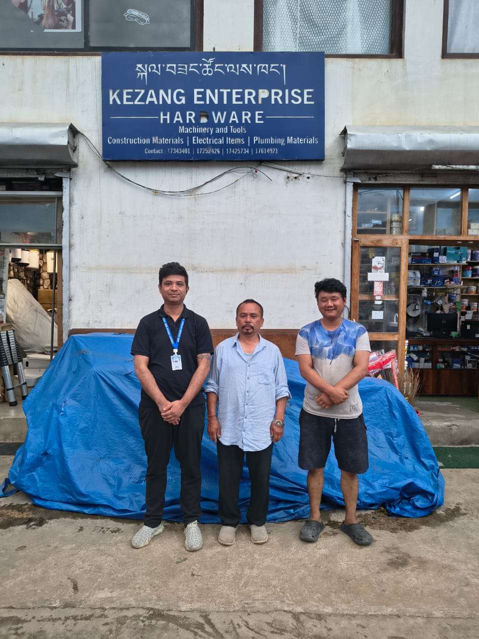 Kezang Enterprise Hardware owner and team with the aBit consultant outside the store in Hejo, Thimphu