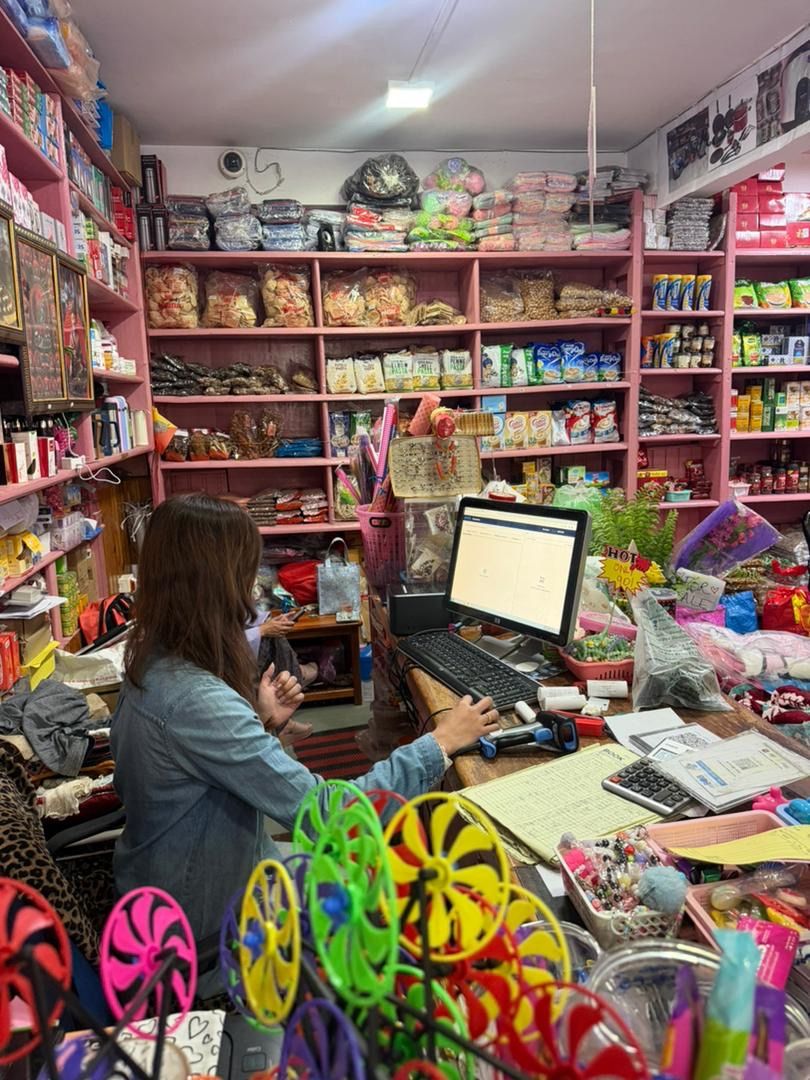 aBitPOS in use at the Wangchuk Mart counter amid the store's varied product range
