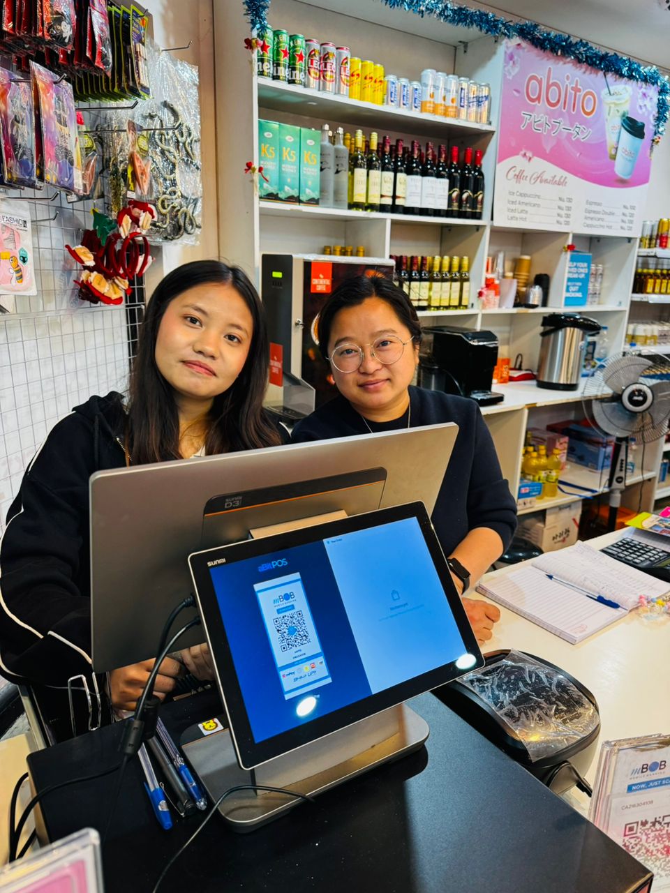 Abito convenience store staff with aBitPOS terminal