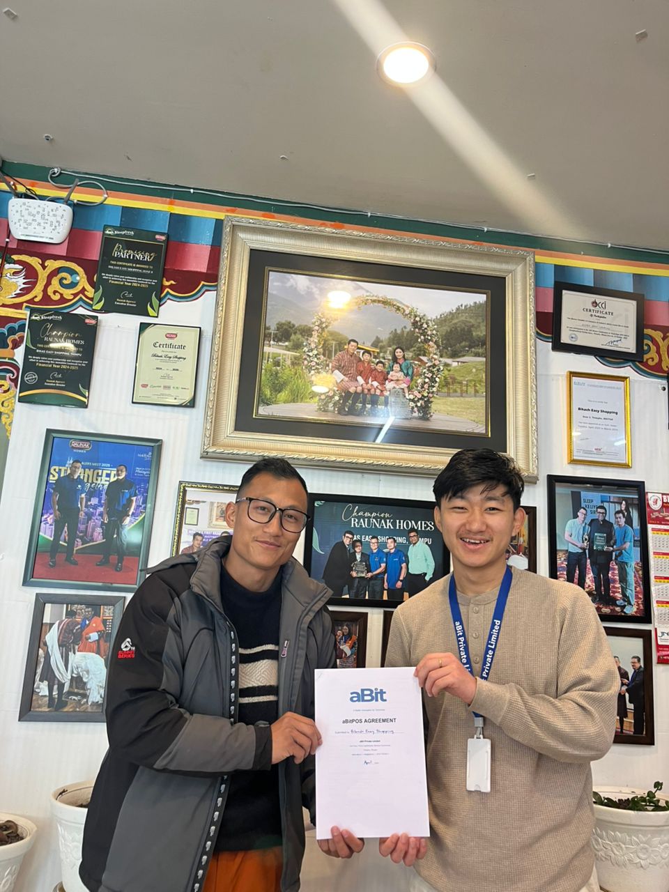 Bikash Easy Shopping owner signing aBitPOS agreement