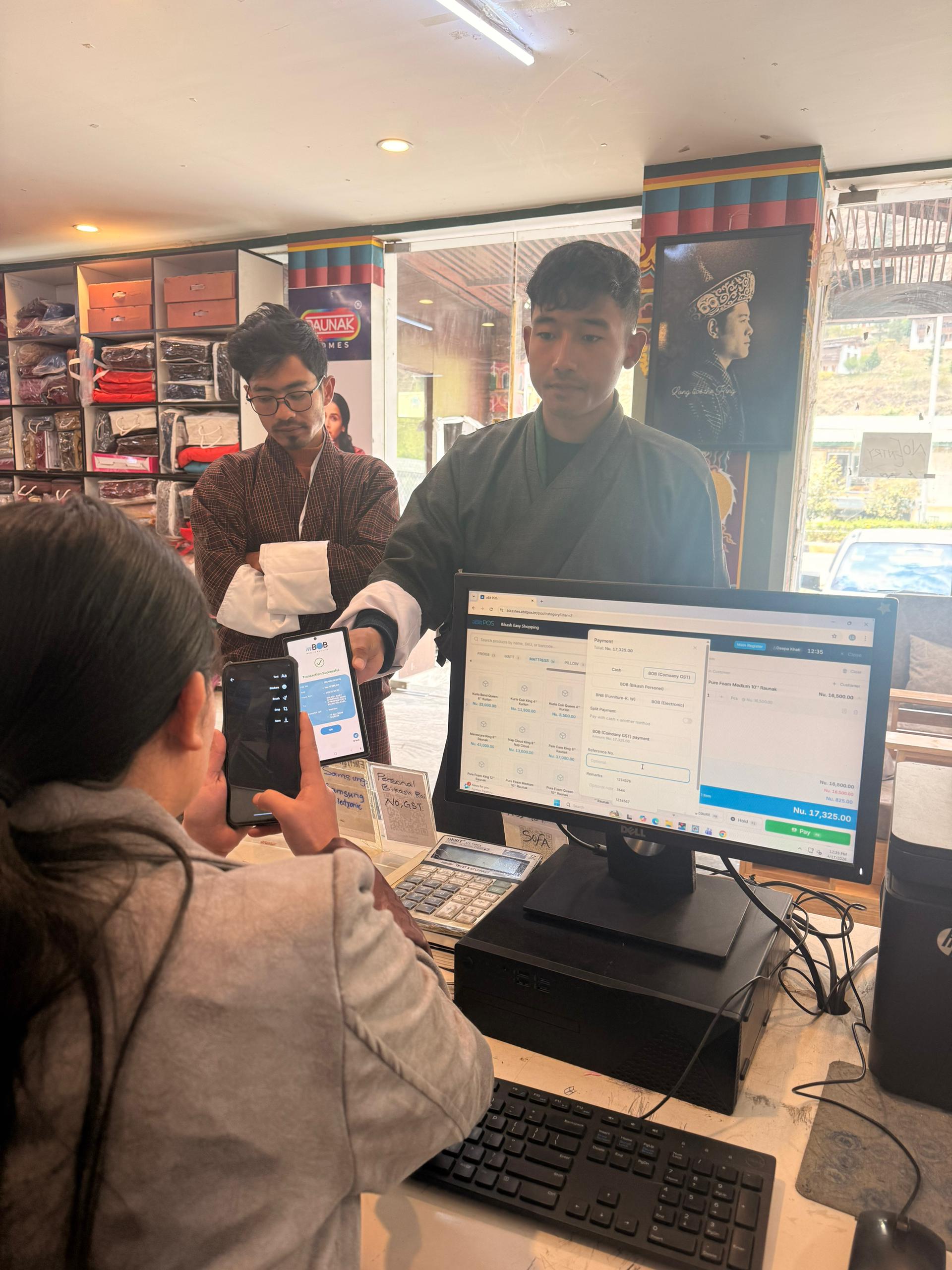 Customer making mBoB payment at Bikash Easy Shopping with aBitPOS terminal