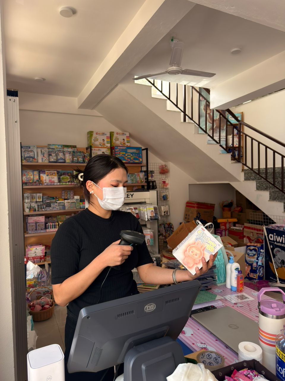 Staff scanning a product with barcode reader at Kelden Baby Haven