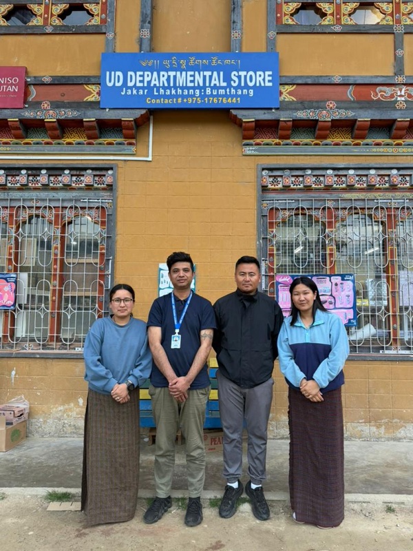 UD Departmental Store team with aBit consultant outside the Jakar storefront in Bumthang